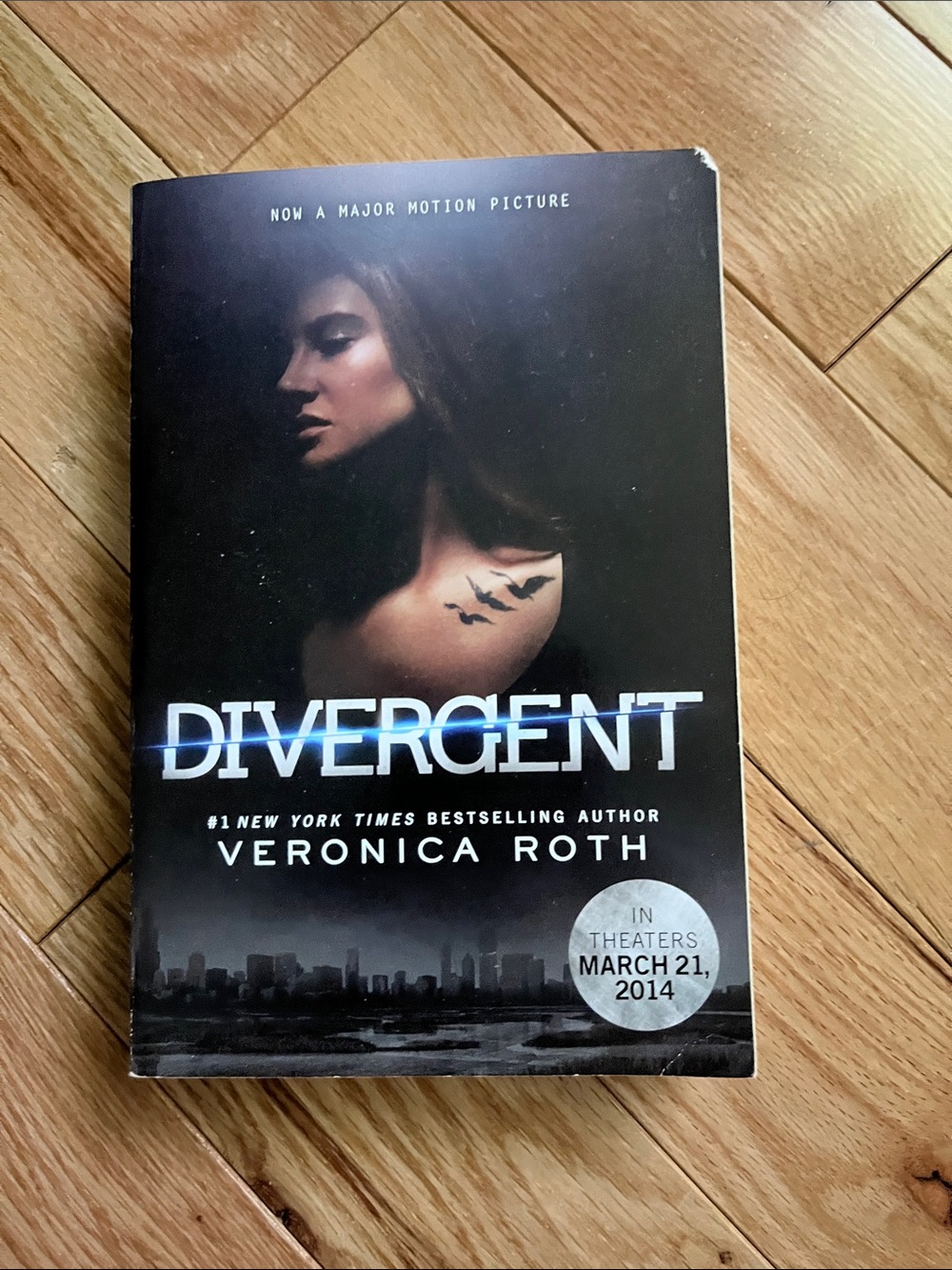 Divergent by Veronica Roth. Black Hardcover Book